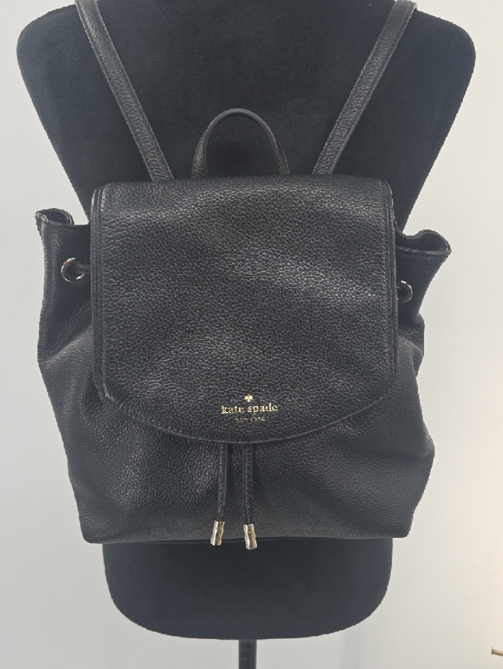kate spade Black Pebbled Leather Drawstring Backpack with Gold Accents